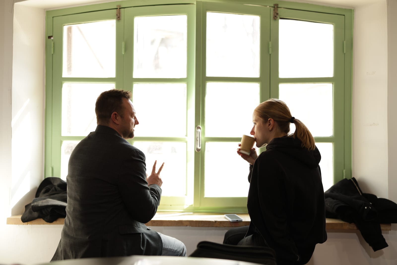 An investor and a founder in a one-to-one meeting by the window